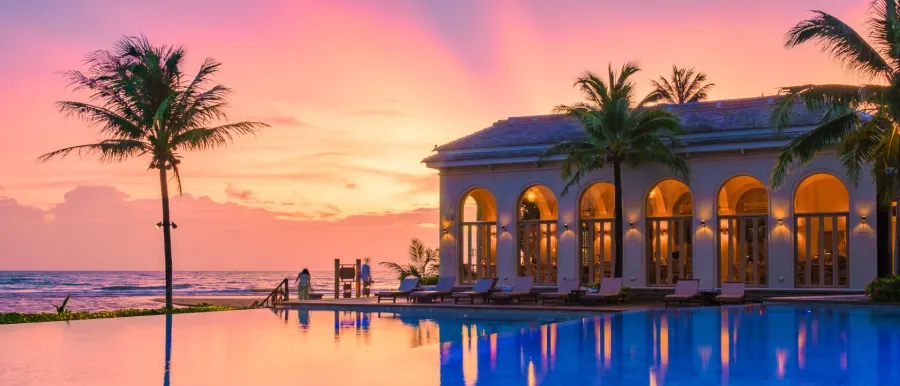 Beachfront resort at sunset